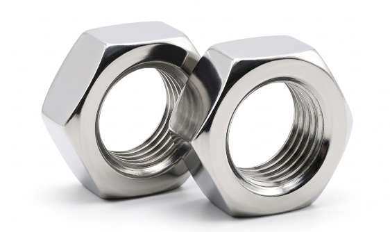 Close-up of Aurum Overseas stainless steel 304, 304L, and 304H series nuts, precision-engineered for superior corrosion resistance and structural reliability in food processing, pharmaceutical, and general industrial fabrication assemblies.